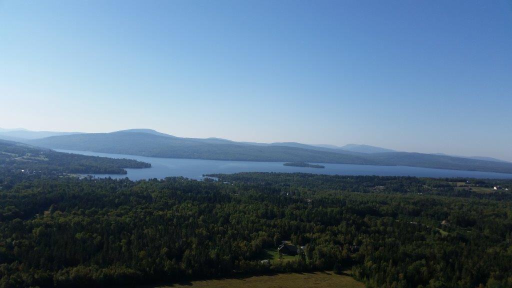 Hills, trees, and a lake near the airport